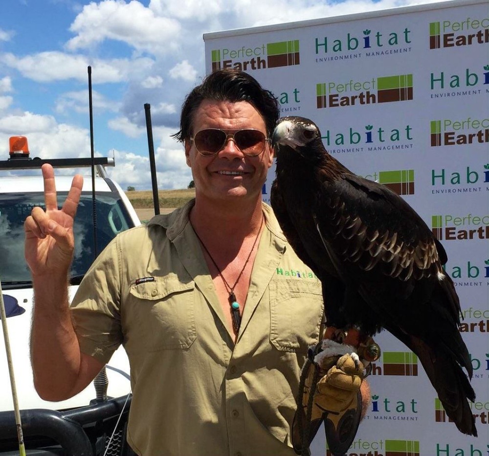 Matt Keys holding a wedge-tailed eagle